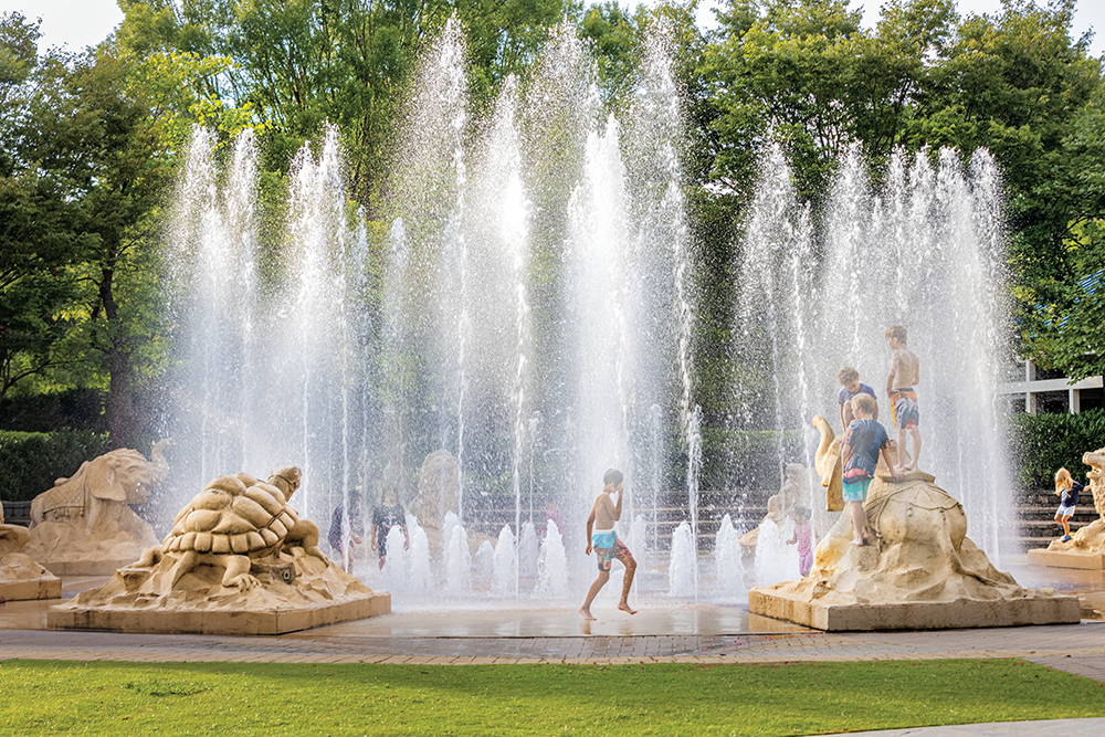 Children play in the fountains at Coolidge Park in Chattanooga, TN.
