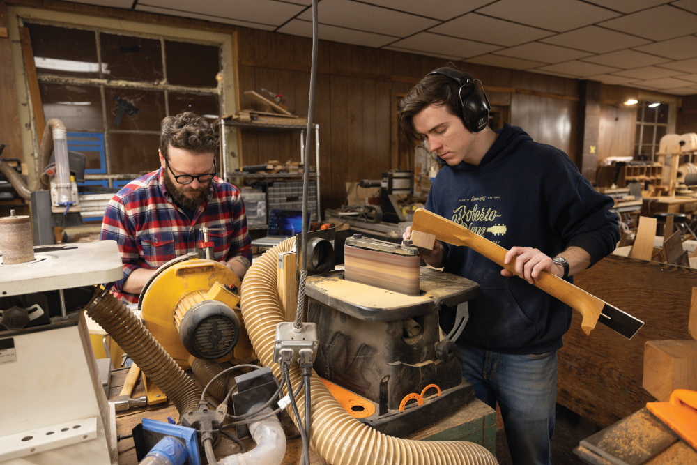 Cameron Painter, left, and Garrett Case build guitars at Gallagher Guitars in Murfreesboro, TN