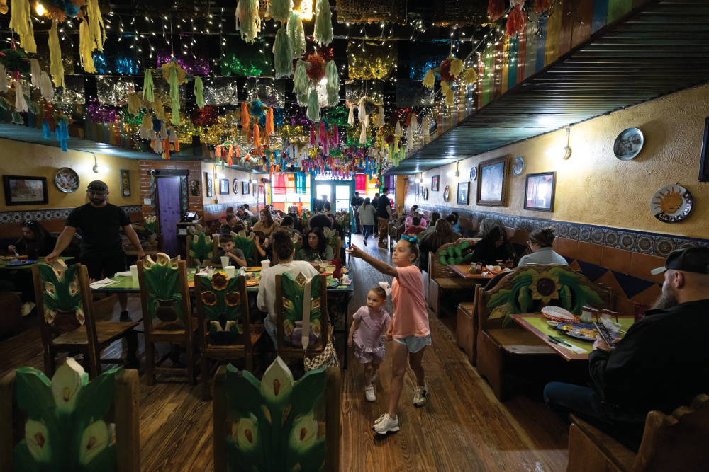 Young visitors explore the restaurant at Don Juan on the Square in Tyler, Texas.