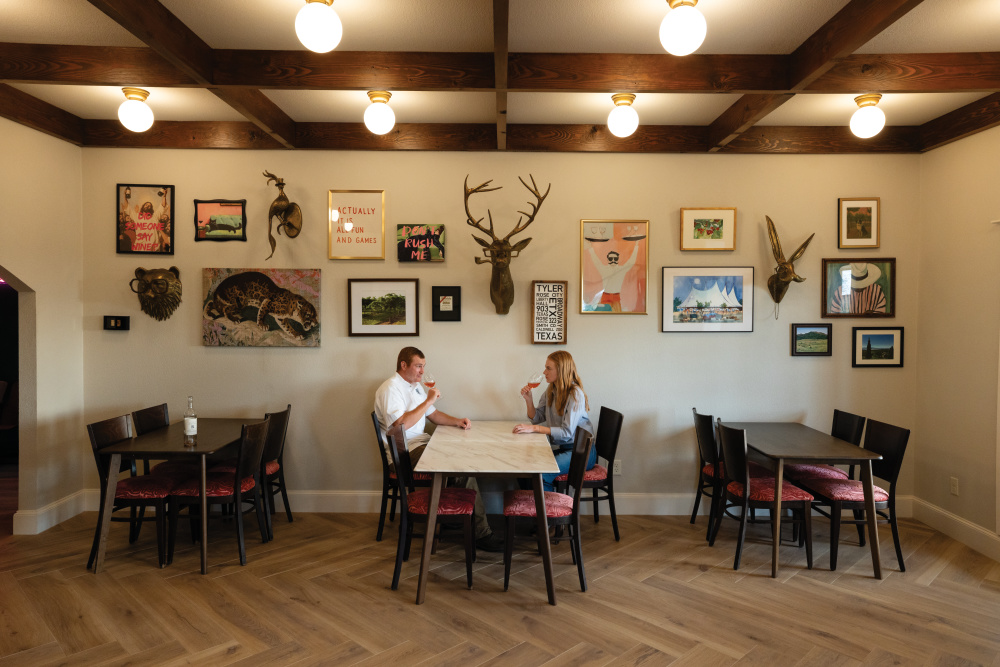 Mason Dacus and his sister Sydney Dacus, co-owners and operators of Rio Neches Estate Winery discuss business in the tasting room in Tyler, Texas.