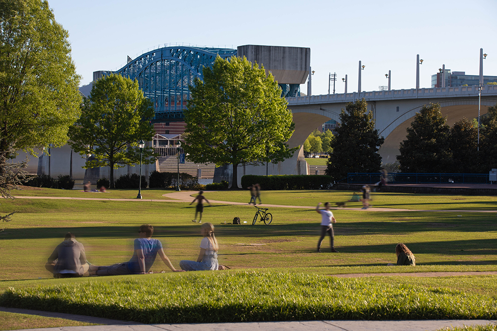 Visitors enjoy time outdoors in the warm spring weather while spending time at Coolidge Park in the Northshore neighborhood across from downtown Chattanooga, TN.