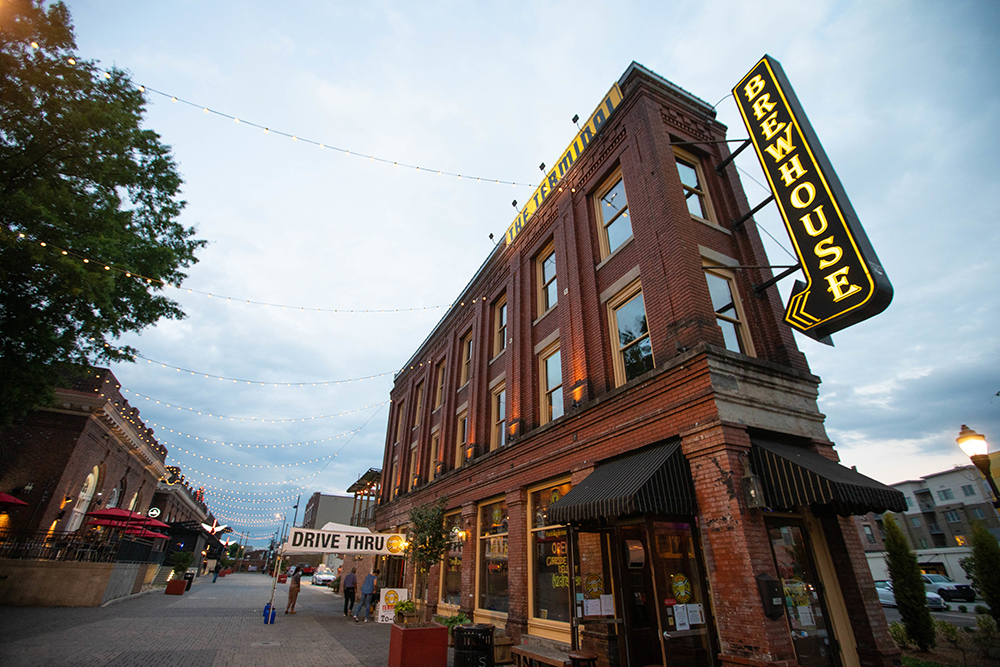 The Terminal Brewhouse lights up at dusk in the Southside District neighborhood of downtown Chattanooga, Tennessee.