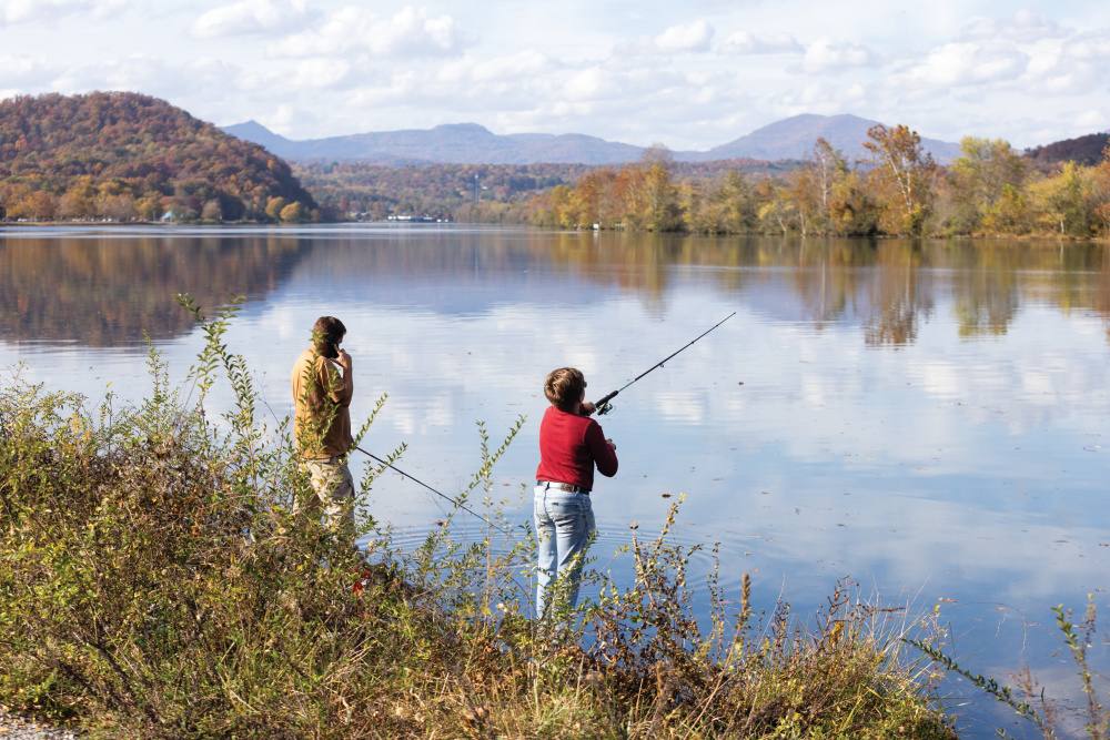 Visitors fish along the shores of Melton Hill Lake in Oak Ridge, Tennessee.