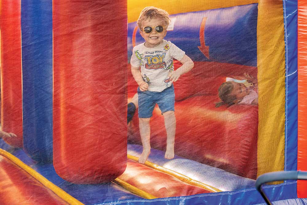 A child plays in a bounce house at 515 Day in Ames, IA.