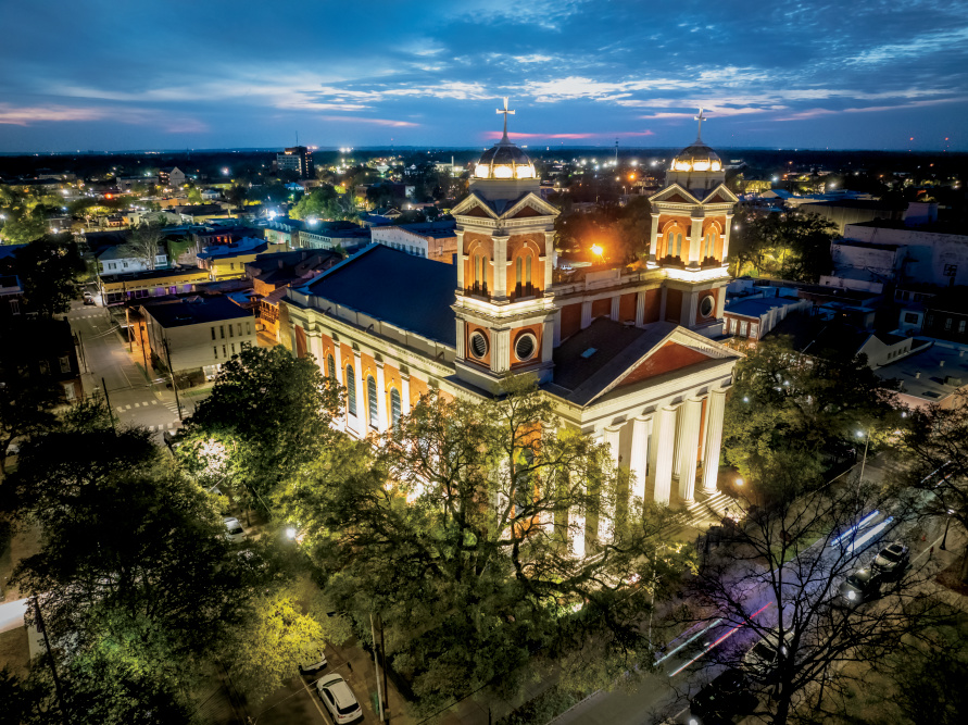 The Cathedral - Basilica of the Immaculate Conception lighst up at dusk along the Alabama Dora Franklin Finley African American Heritage Trail in downtown Mobile, Alabama.