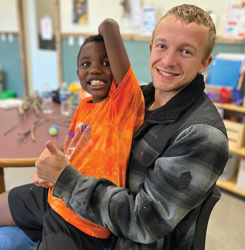 A child and an adult at Cultivating Hope Farms