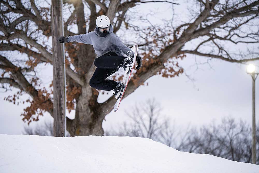 Snowboarder catches some air s at Seven Oaks Recreation during a classic central Iowa winter.