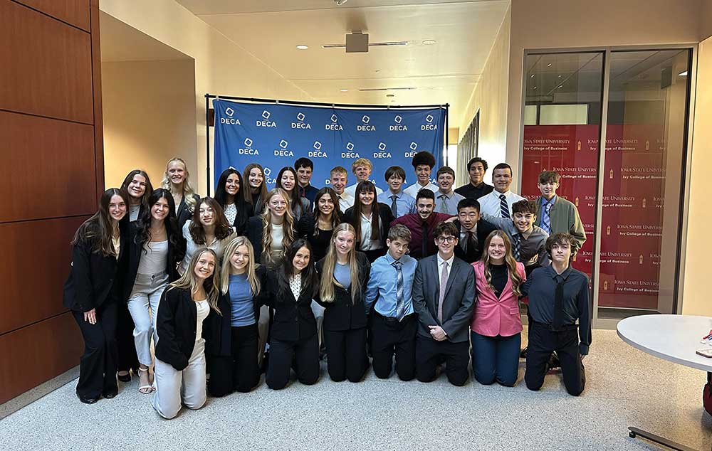 Gilbert High School DECA students practicing business presentations in Iowa.