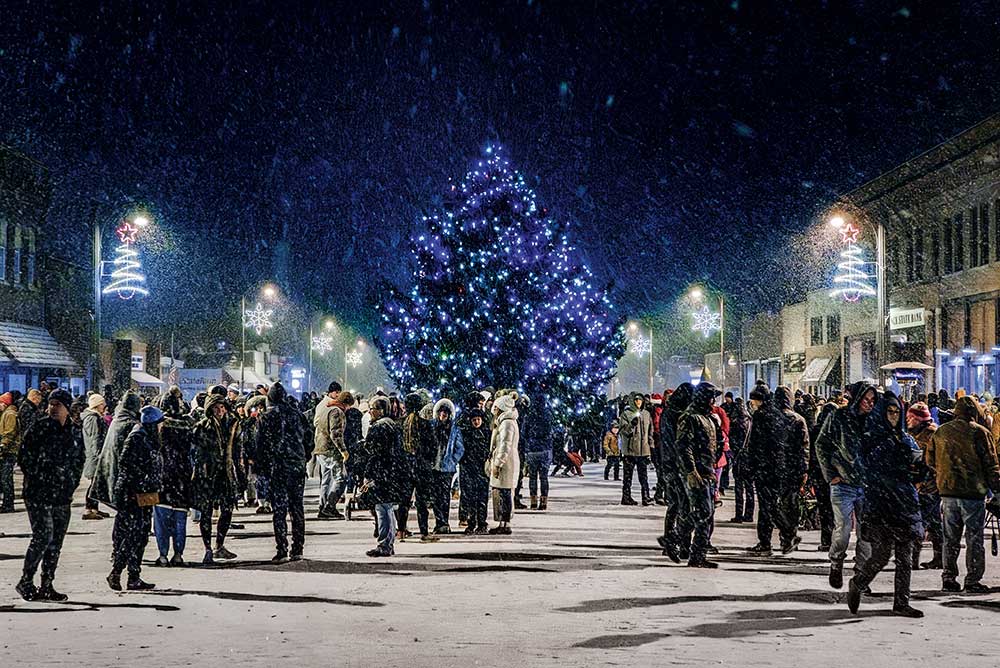 Snow falls during the tree lighting ceremony at Yulefest Weekend in Story City.