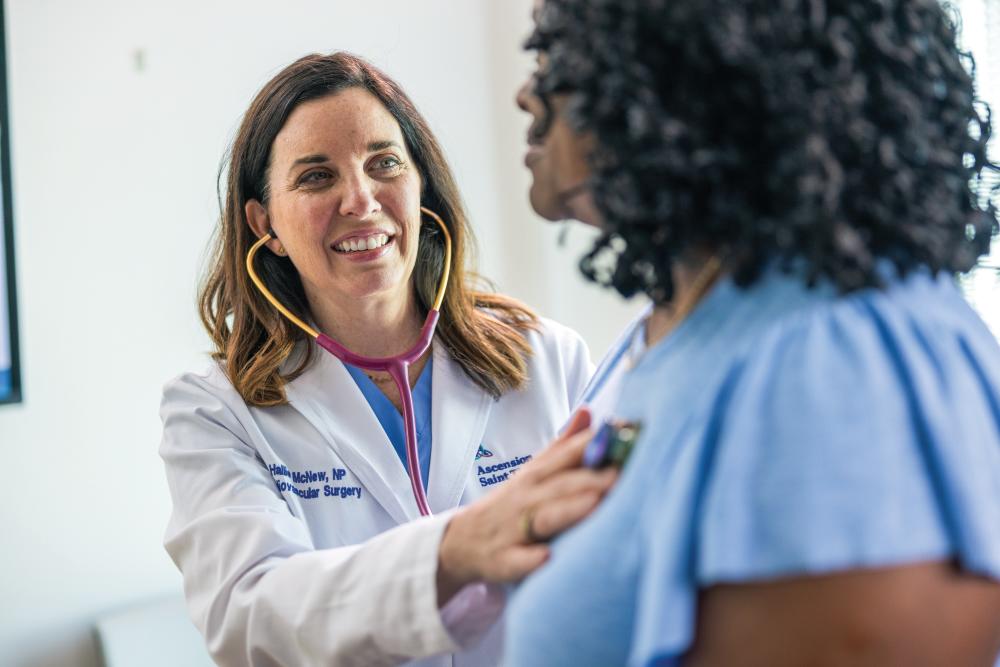 An Ascension Saint Thomas Rutherford doctor assisting a patient