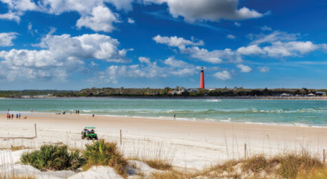 Beautiful beach and Lighthouse Ponce de Leon Inlet from New Smyrna beach, Florida.
