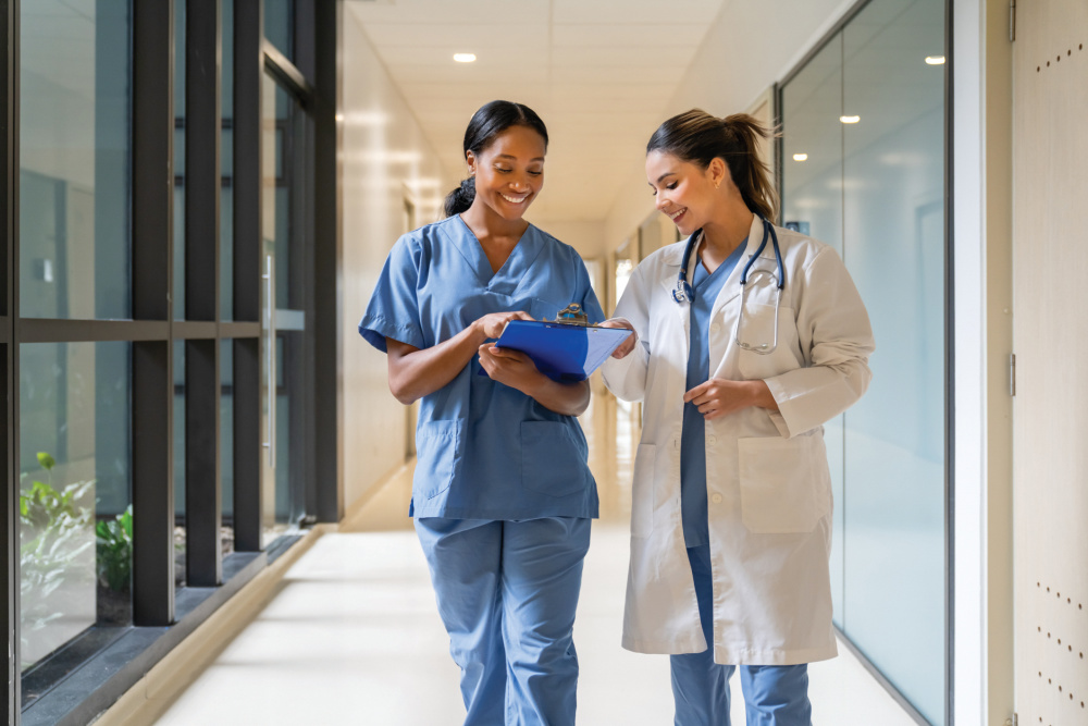 nurse and doctor walking and talking