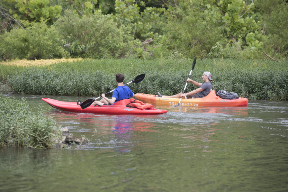 Visitors kayak down the Duck River in kayaks from River Rat Canoe and Kayak Rental in Columbia, Tennessee.