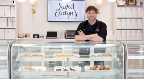 Cory Allen Jones stands behind the pastry counter at Sweet Evelyn's in Perry, Georgia.