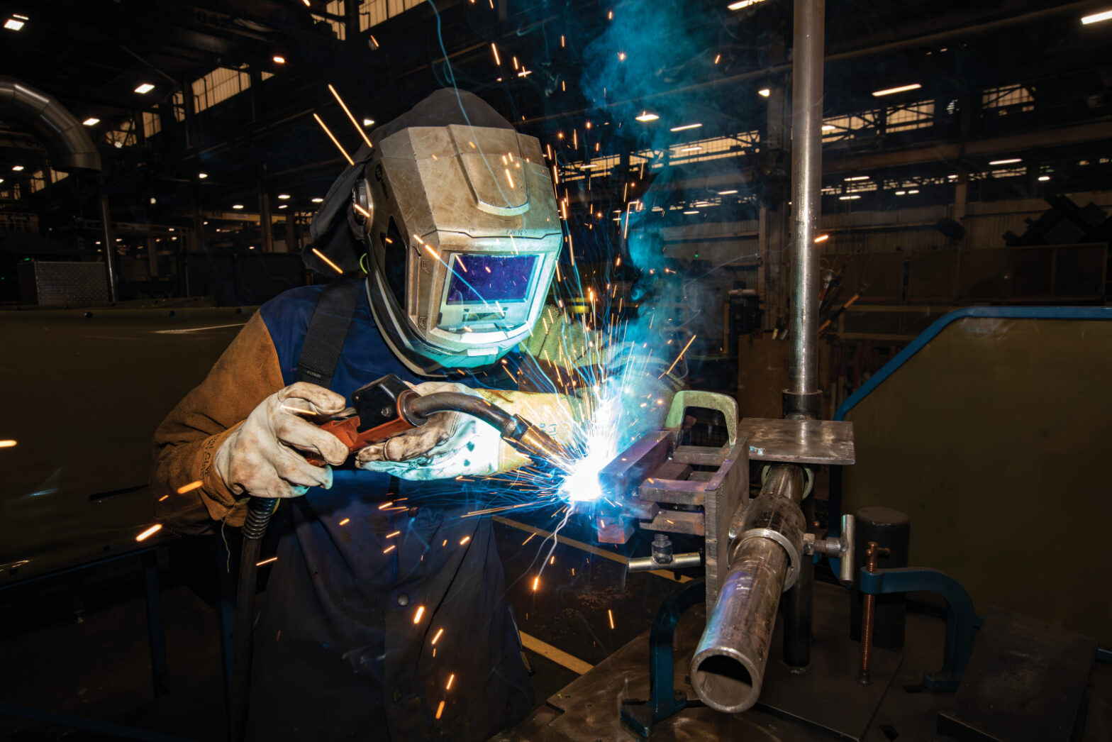 Komatsu pre-apprenticeship program student Samuel Herron works on a welding station in Komatsu America Corporation’s manufacturing plant in Chattanooga, TN.