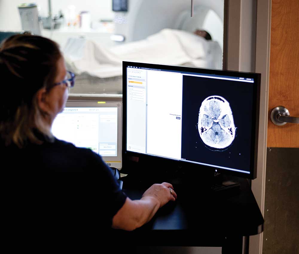 Tech reads the screen at Northern Regional Hospital.
