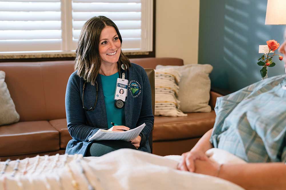 A health care professional speaks with a patient at Mountain Valley in Surry County, NC.