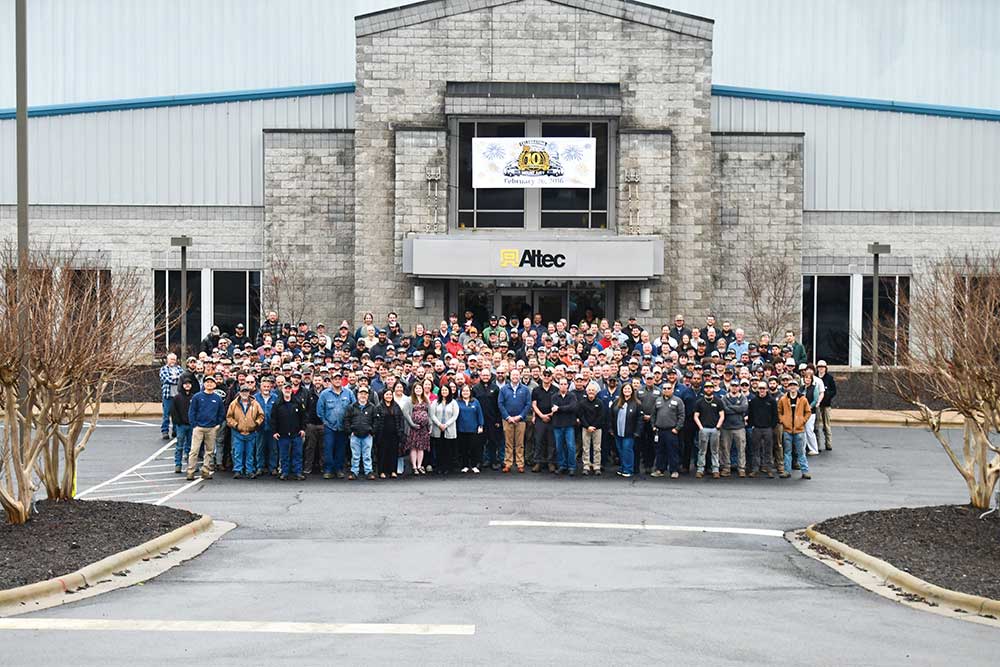 Employees stand outside of the Altec Building in Surry County, NC.