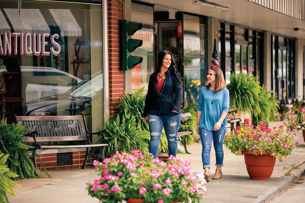 Women walk along the streets of downtown Pilot Mountain, NC.