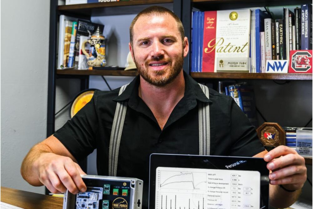 Ben Durbin in his office showing True Force Technologies benefits.