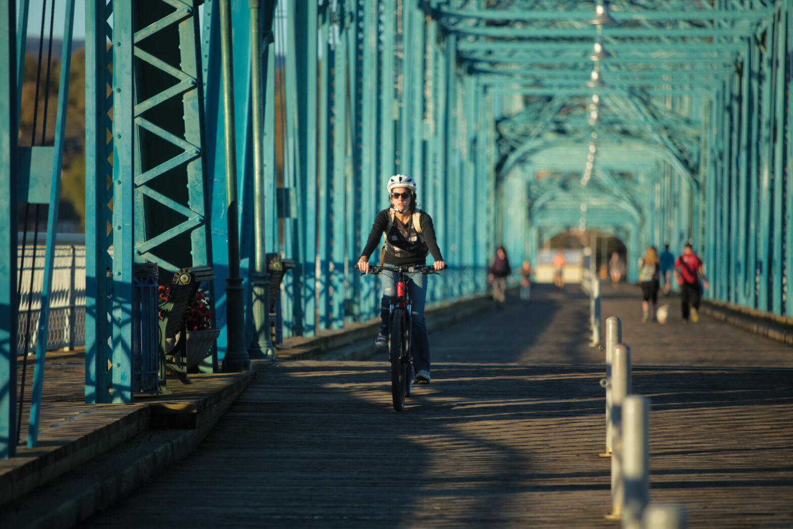 Pedestrians make their way over the Walnut Street Bridge which links North Shore neighborhood to downtown Chattanooga, TN.