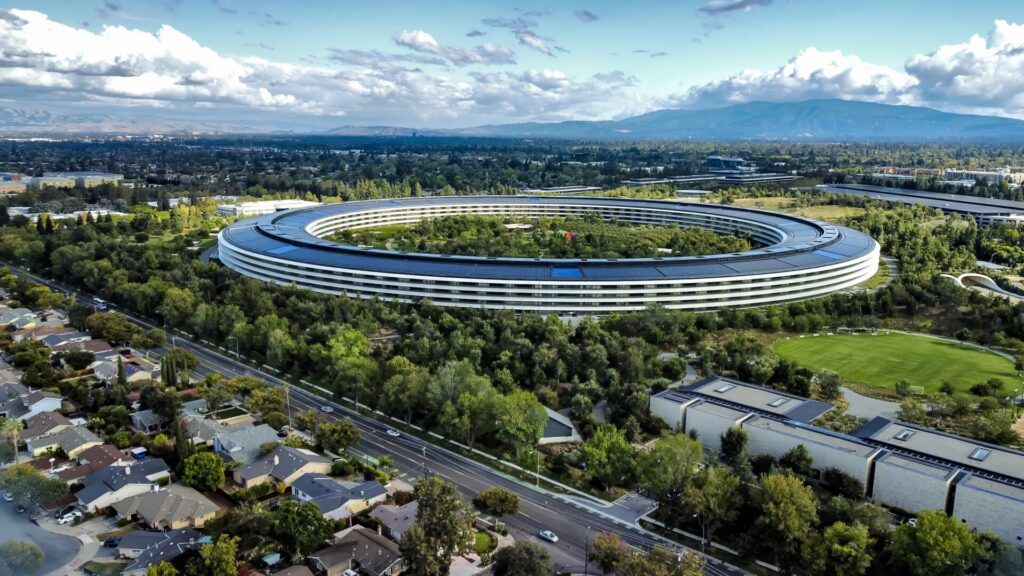 Sunnyvale, CA-September 9, 2022: View of Apple Park as seen from the neighboring areas of Sunnyvale in the middle of Silicon Valley. Apple Park serves as the headquarters for Apple Computer, Inc. The rooftop is covered with solar panels to provide power during the day. Apple designs computers, mobile phones, tablets, and many other technologies.