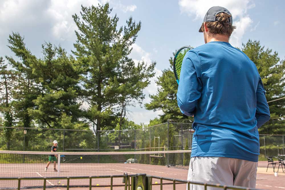 People participate in a tennis camp in Beavercreek, OH.