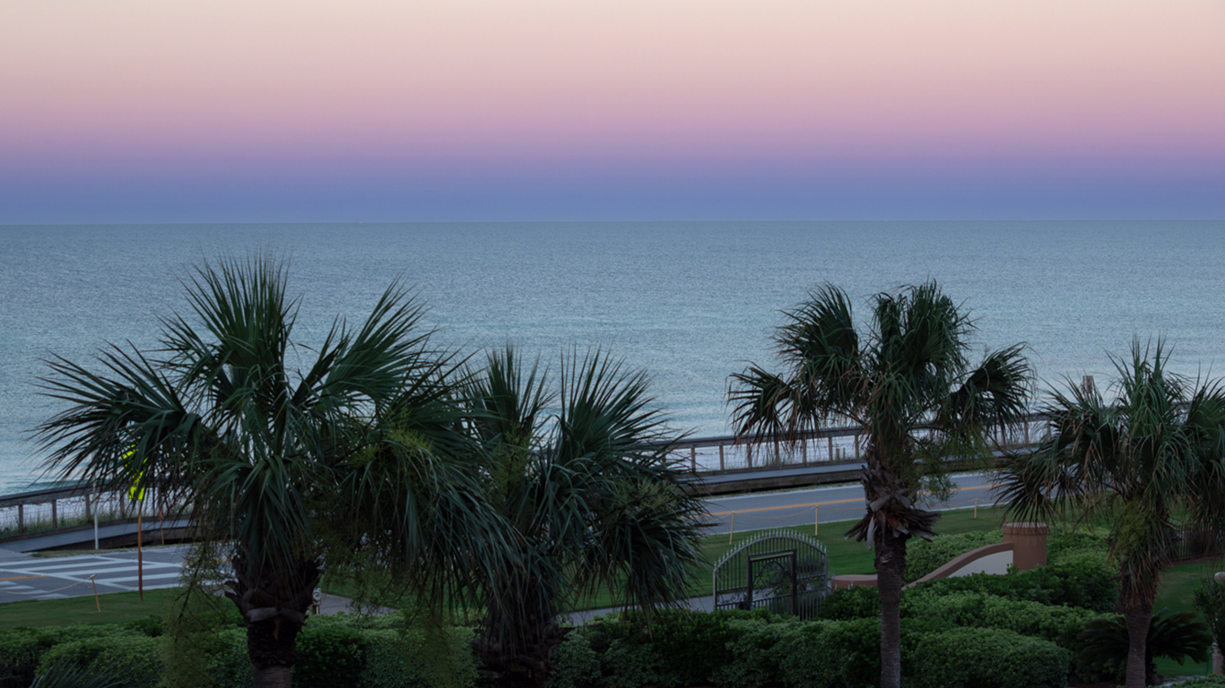 A pastel sky at the break of dawn over Miramar Beach on the Gulf coast of Florida.
