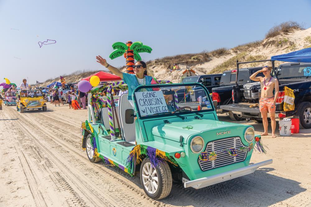 photo of a jeep on a beach at Barefoot Mardi Gras