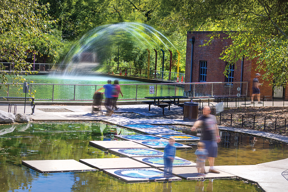 Families explore the outdoors features at Murfree Spring Wetlands at the Discovery Center in Murfreesboro, TN.