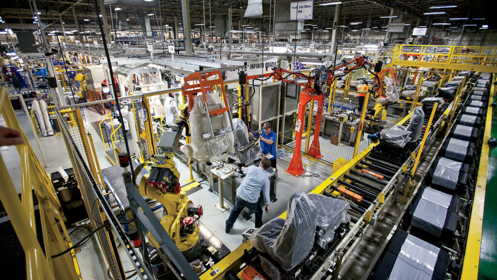 Employees work to assemble seats for Nissan automobiles at Johnson Controls in Murfreesboro, TN.