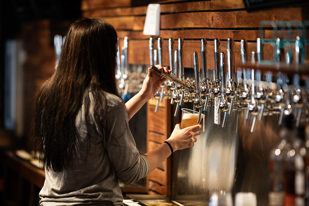 Bartenders pour beer for customers at Hop Springs Beer Park in Murfreesboro, Tennessee.