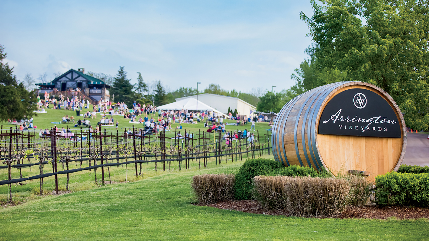 Visitors listen to live jazz while relaxing on the hillside overlooking the vineyard at Arrington Vineyards in Arrington, TN.