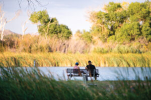 People enjoy and some cycle the Mojave River Walk in the Mojave Narrows Regional Park, Victorville, Calif.,
