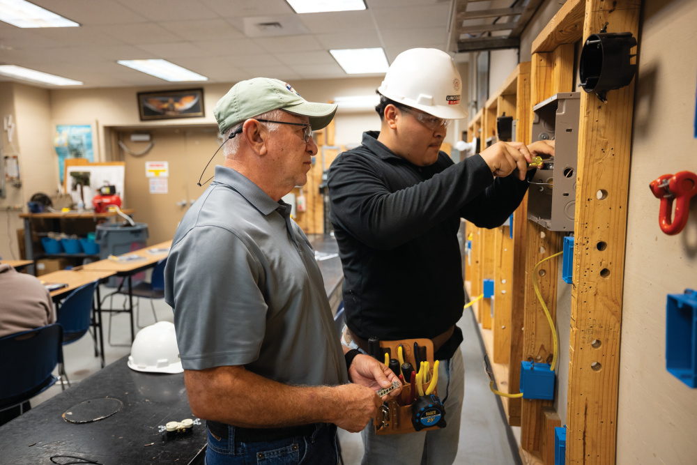 Instructor David Barrera works with Brandon Ochoa in the residential electrician program at the Craft Training Center of the Coastal Bend in Corpus Christi. 