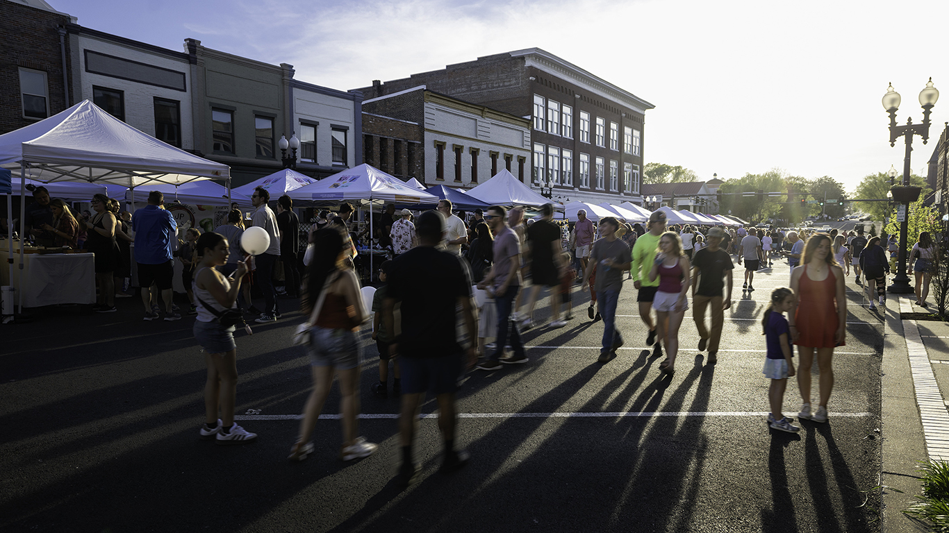 Visitors stroll around the vendors during First Fridays, put on by Columbia Main Street, in downtown Columbia, TN.