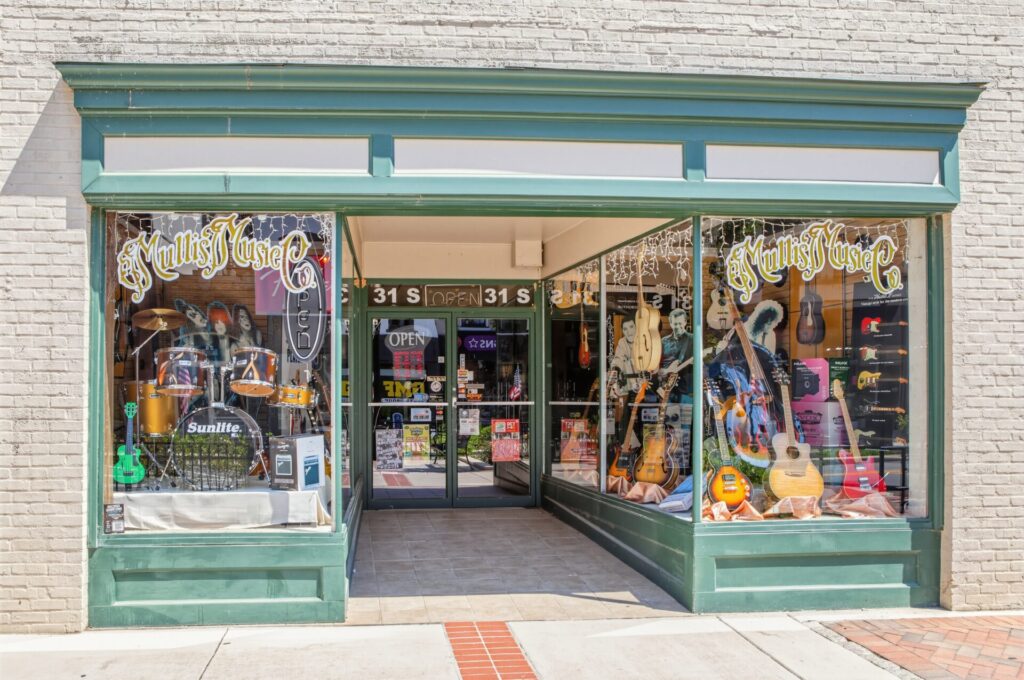 Outside the Mullis Music storefront, a charming, old-school independent music shop