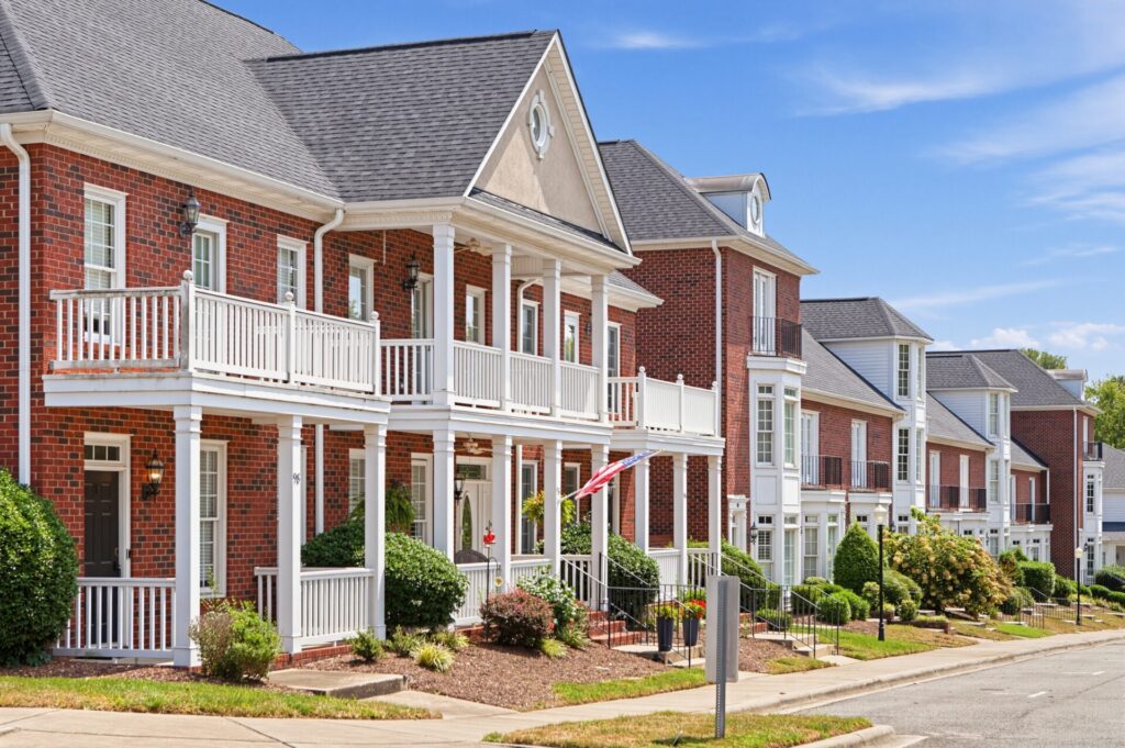 A row of homes winding along a sidewalk in Afton Village In Concord, NC