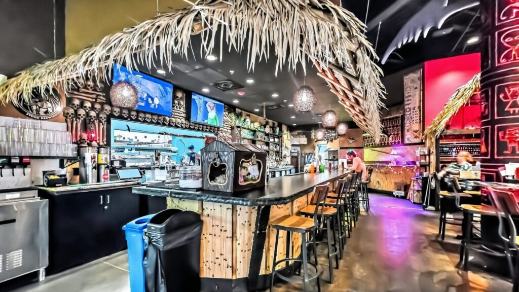 Interior of Pinky's Westside Grill looking at their hut-style bar
