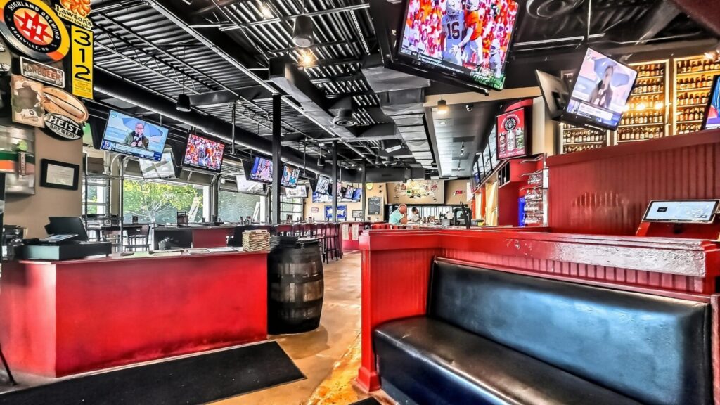 Interior entrance and bar seating of Duckworths Grill in Huntersville