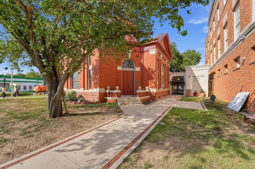 Shaded pathway to Dr Eugene Clark Library in Lockhart, TX