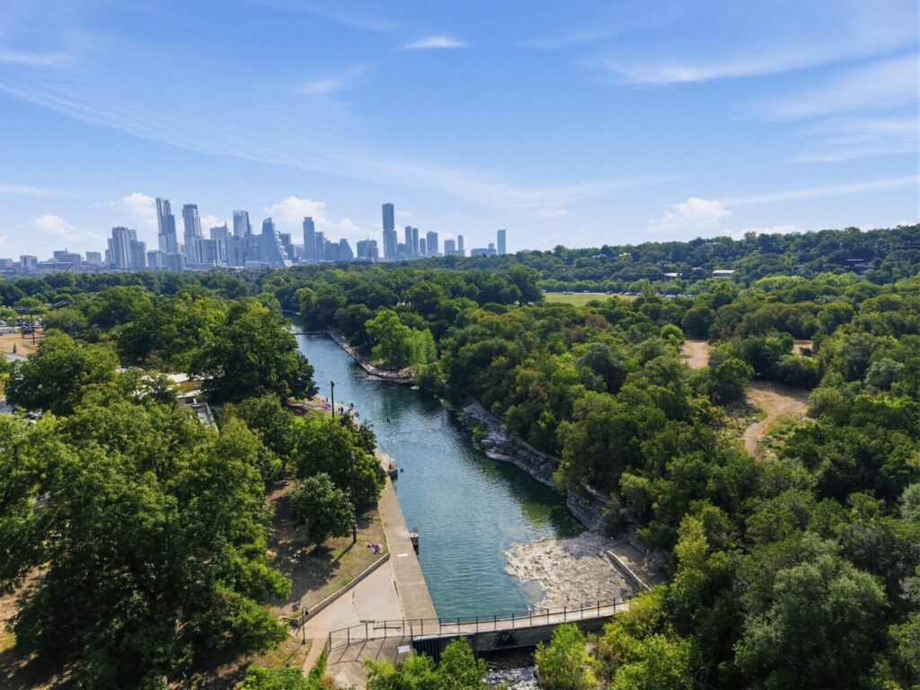 Barton Springs Pool in Austin, TX, is fed by underground springs, offering cool water year-round.