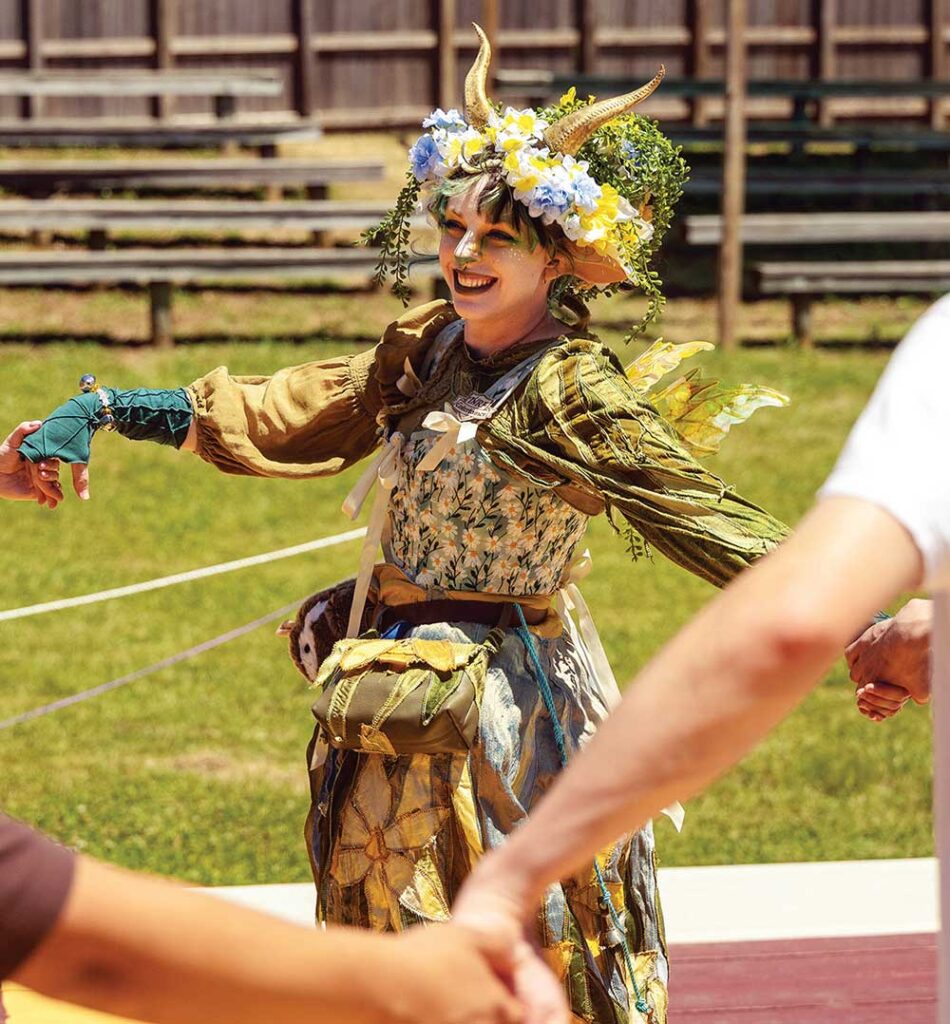 Children in medieval costumes in front of the castle at the Tennessee Renaissance Festival in Arrington, TN