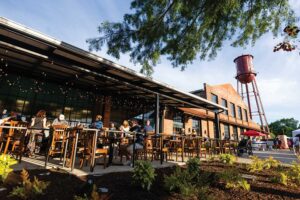 Visitors dine outdoors at the new Edley's Bar-B-Que location at The Factory at Franklin in Franklin, Tennessee.