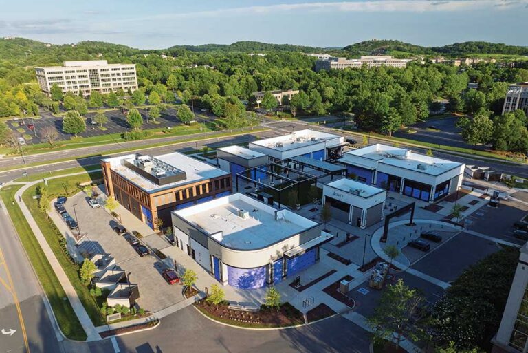 Aerial view of the Canteen on Carothers mixed-use development, with modern buildings arranged around a central plaza in Franklin, Tennessee