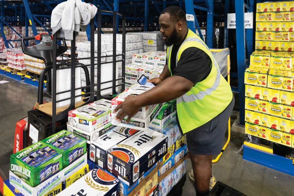 Chianti Mason prepares an order to be shipped at Gulf Distributing in Mobile