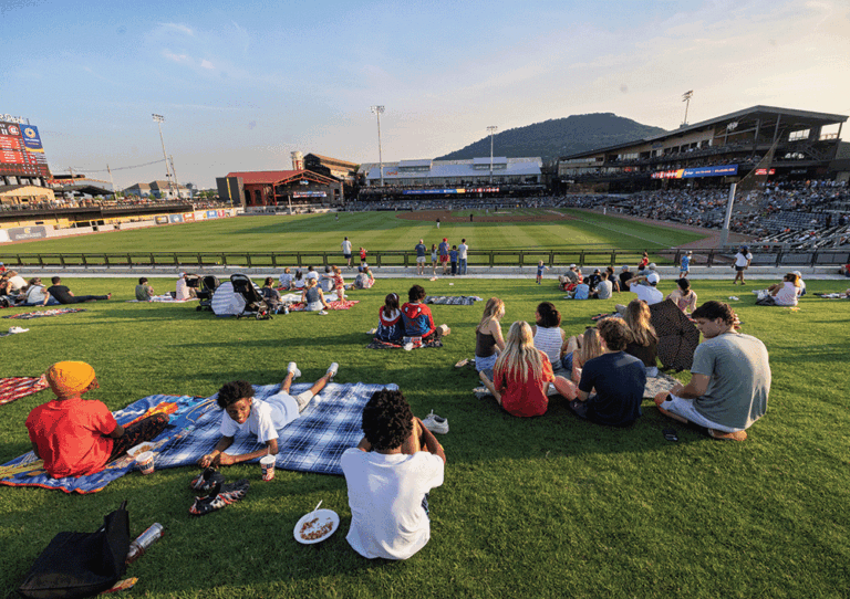 Fans watch the game from the Little Debbie Berm at the new Erlanger Park, which is home to the Chattanooga Lookouts baseball team.
