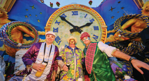 Members of the Mystics of Time (MOT) mystic society on board a float in Mardi Gras in Mobile, AL
